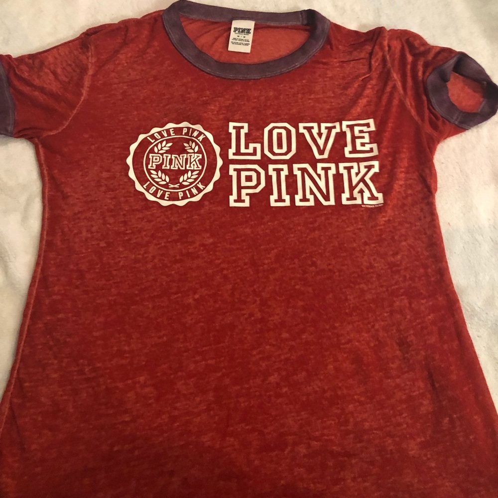 A sheer Pink Brand shirt.